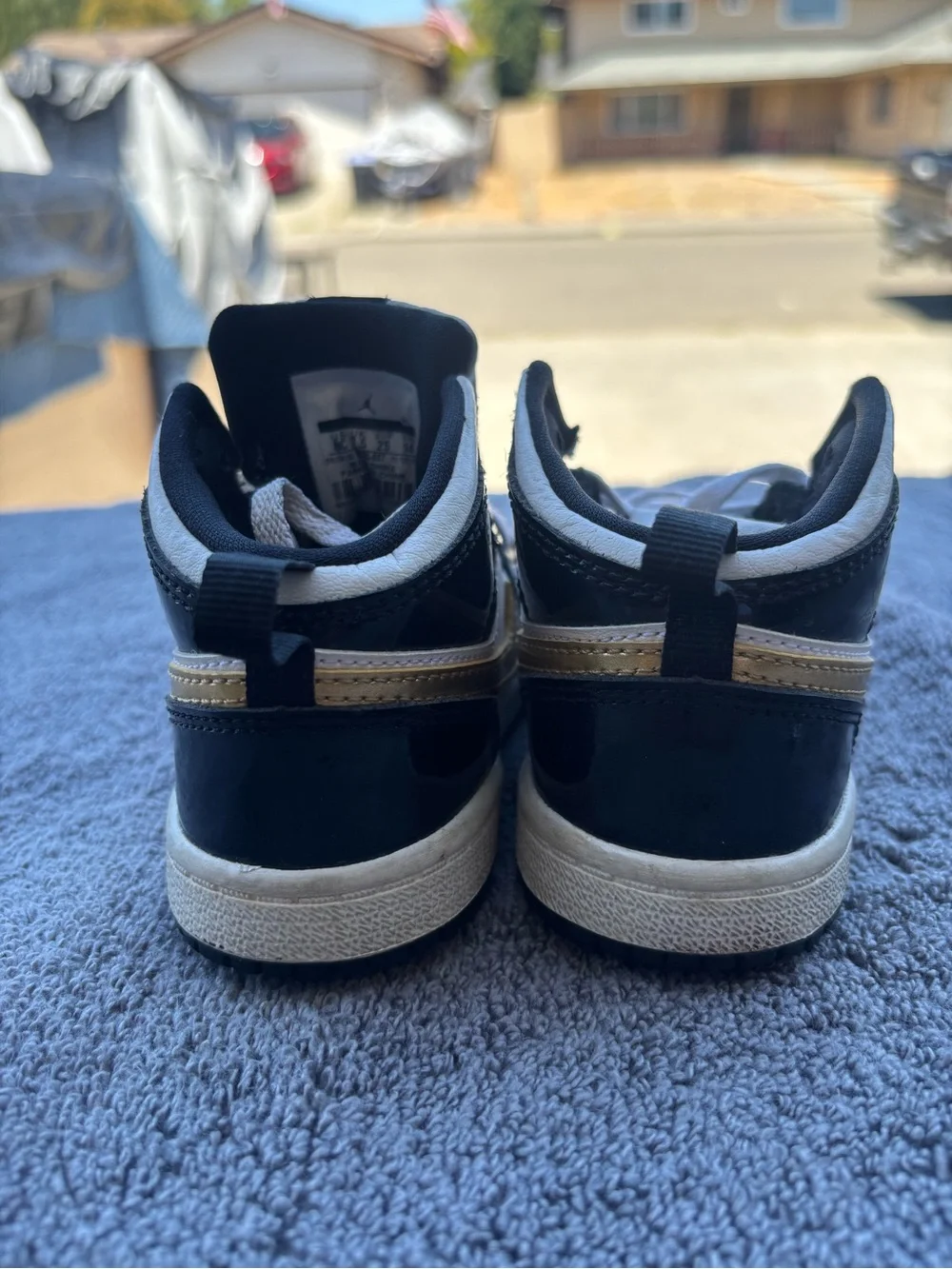Jordan Kids Black and White High-Top Sneakers with Perforated Toe